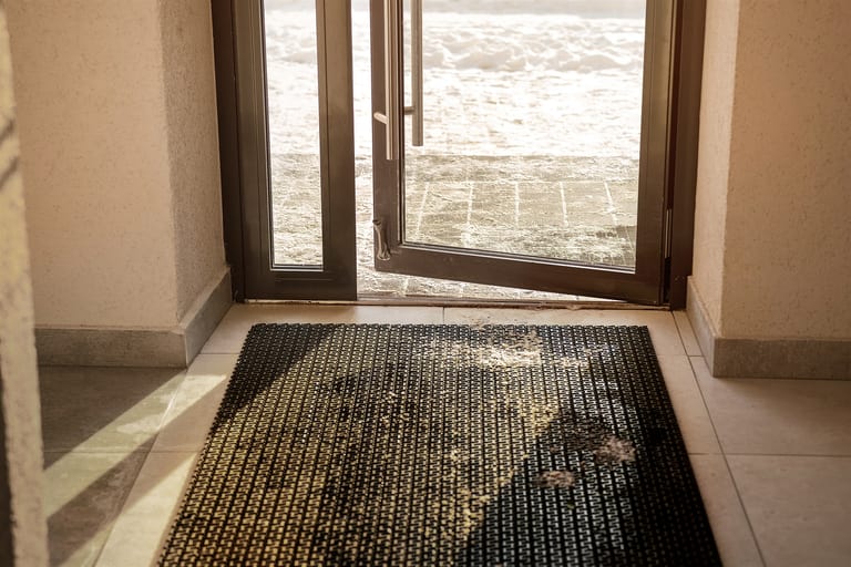 Wet and muddy entrance mat in winter